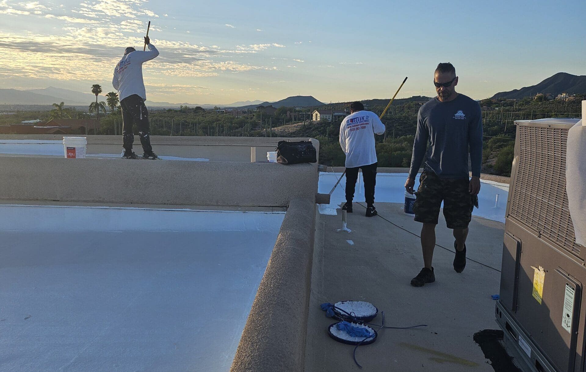 roofers in tucson doing a roof inspection, a roof maintenance service for tucson's rainy season