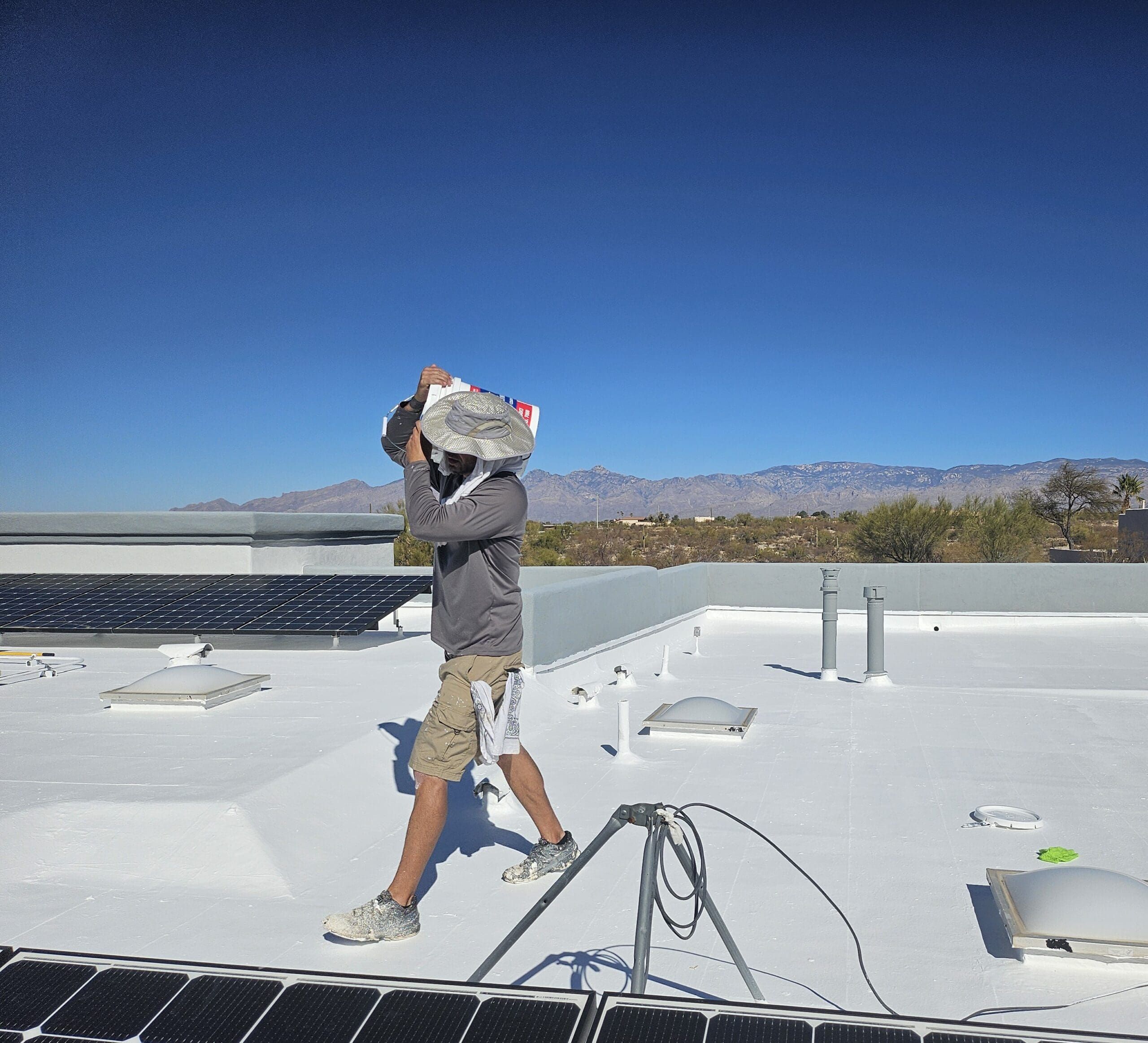 man doing roof inspection