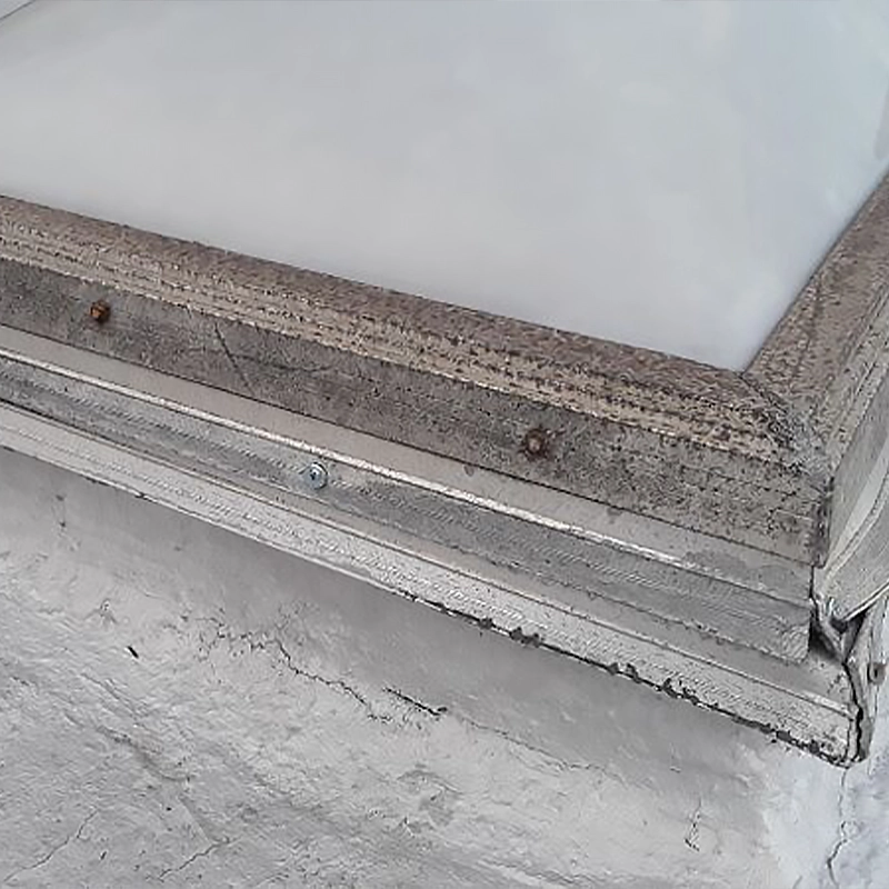 cracks in the metal flashing of a skylight installation