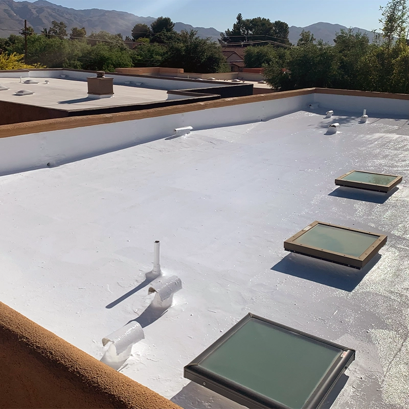 professional skylight installation on a flat coated roof